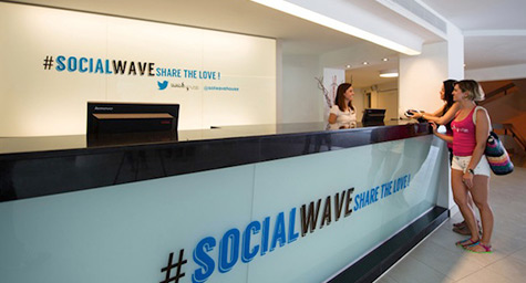 While most people vacationing in Majorca try to do no work, now there’s a hotel for those who want to network. Spain’s idyllic island is home to the Sol Wave House, where the guest experience revolves around tweets, hashtags, and networking. PSFK.com profiled the high-tech hotel to show why the digital destination has social seekers all atwitter. Making its mark as the “first Twitter experience hotel,” the year-old Sol Wave House integrates social media into every aspect and amenity of the guest’s visit. These include social-centric guest rooms, Twitter concierge assistance by hashtag, and an online community called #SocialWave where guests can tweet and meet each other. The #SocialWave community is exclusive to guests and can only be joined by logging onto Twitter through a special app on the hotel’s WiFi. Becoming part of the #SocialWave community lets guests see who else is online, learn where new friends are hanging out, tweet private messages, share photos, and send virtual kisses. The community is designed to be an enjoyable and interactive way to enhance the hotel experience by making it easier for guests to do the social sharing they love to do. In addition to the online community, the Sol Wave House infuses Twitter into its many fun features. Guests can first go to the #TwitterPoolParty on Fridays and treat themselves to Twitter-themed cocktails. Then they can hang out with their new social circle in a Twitter Party Suite, where up to four guests can party amidst bright blue balloons, hashtag licorice, and a mirror that prompts tweet-worthy moments. Later, they can get food by the pool by simply tweeting their order to @SolWaveHouse. At the Sol Wave House, social seekers can engage in a truly virtual vacation. Keep up with the latest on the social media scene. Contact MDG today at 561-338-7797 or visit www.mdgsolutions.com. MDG is a full-service advertising agency and one of Florida’s top creative ad agencies. With offices in Boca Raton and New York City, MDG’s core capabilities include branding, logo design, print advertising, digital marketing, mobile marketing, email marketing, media planning and buying, TV and radio, outdoor advertising, newspaper, video marketing, Web design and development, content marketing, mobile marketing, social media marketing, and SEO. To stay on top of the latest trends in marketing and advertising, contact MDG today at 561-338-7797. To discover more about how social media communities can experience a shared sense of social support and solidarity, check out “Twitter Users Demonstrate “Tribe” Tendencies.”